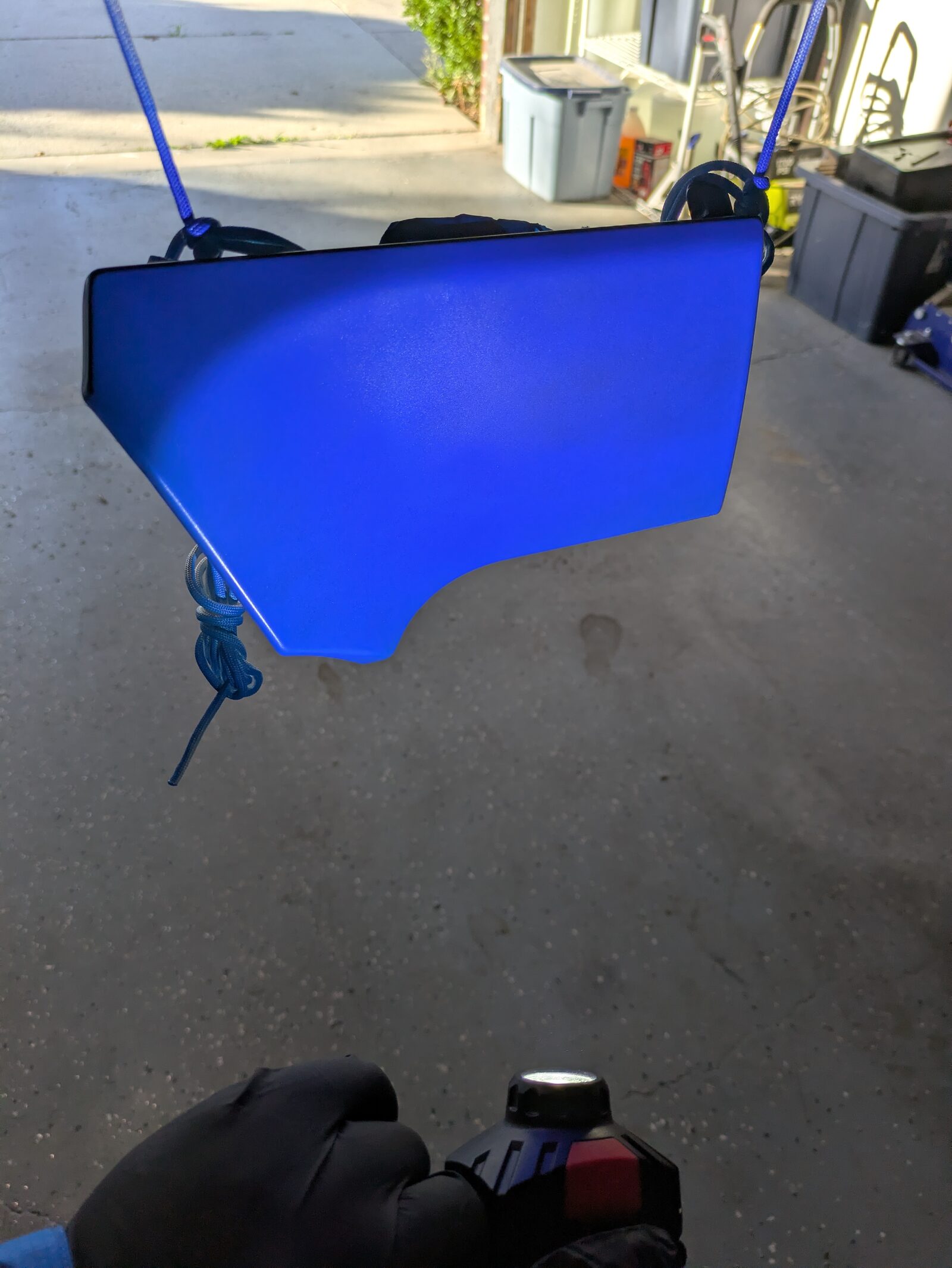 Checking the base coat with a flashlight before clear
